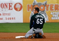 Evan Longoria PIM 017  Evan Longoria kneels at second base after he was tagged out trying to steal second base against the Phillies in Clearwater, FL. - PhotosinMotion.net. : Evan Longoria, MLB, Major League Baseball, SPORTS, BASEBALL, Tampa Bay Rays, PhotosinMotion.net